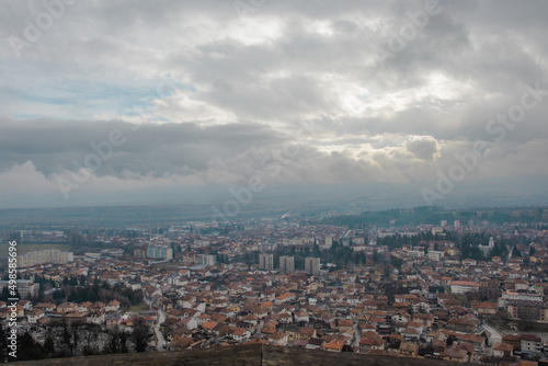 Bird's eye view of Razlog cityscape under a cloudy sky in Blagoevgrad, Bulgaria photo