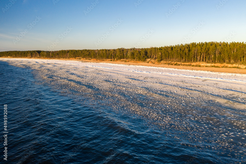 Scenic landscape of shore of Baltic sea at winter. Snow on sand. Scenic landscape of shore of Baltic sea at winter. Snow on sand.