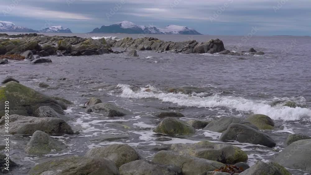 Rocky shoreline in Norway. Runde in background Rocky shoreline in Norway. Runde in background