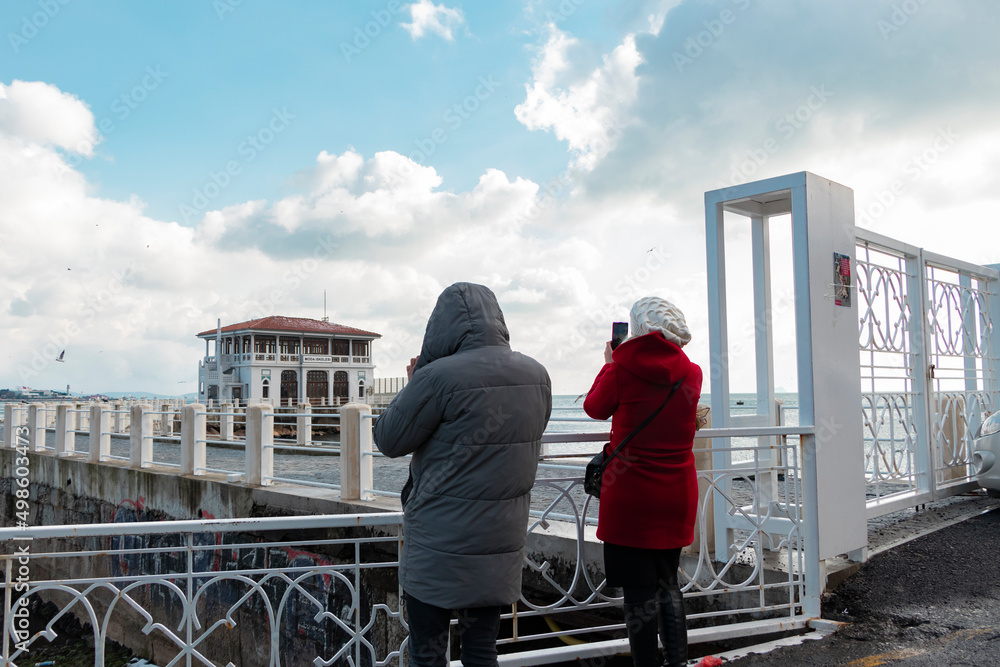 Couple taking photograph of beautiful Istanbul view. Kadıköy, Moda. Couple taking photograph of beautiful Istanbul view. Kadıköy, Moda.