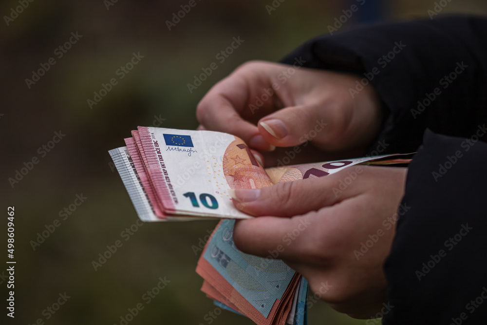 Woman counting euro banknotes - obrazy, fototapety, plakaty 