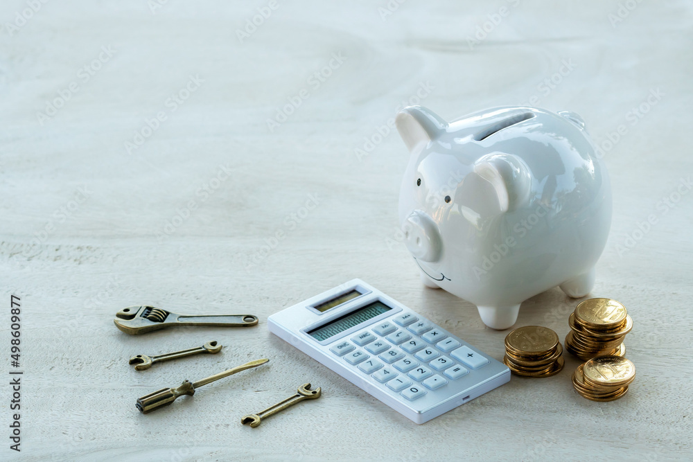 Ταπετσαρία Home models and gold coins and calculator and tools, construction equipment and spanners for building or repairing houses put on the  table, Loan for restoration real estate or build a house concept