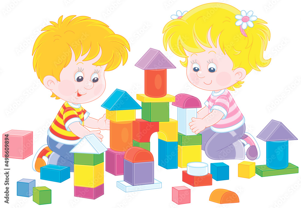 Happy little children playing with colorful bricks and building a toy ...
