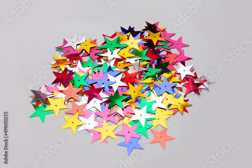 star shaped confetti isolated on gray surface