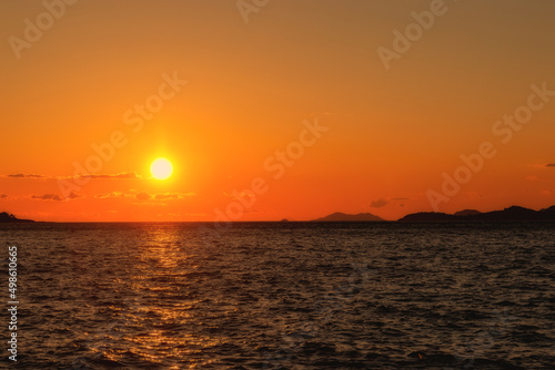 The sun sets over the horizon in the Adriatic Sea