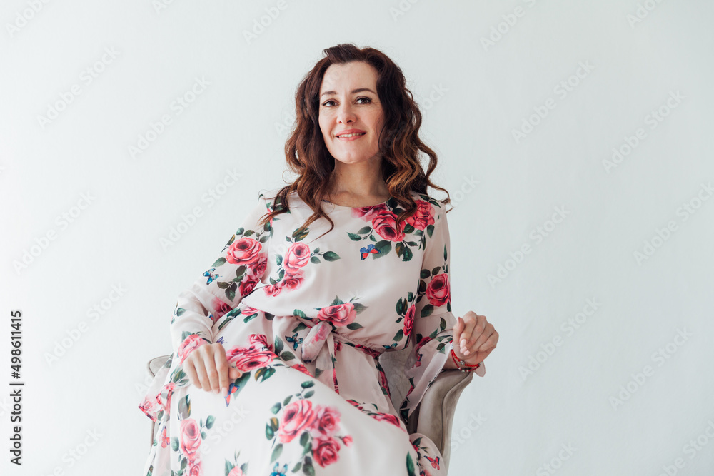 beautiful brunette woman in a summer dress with flowers beautiful brunette woman in a summer dress with flowers