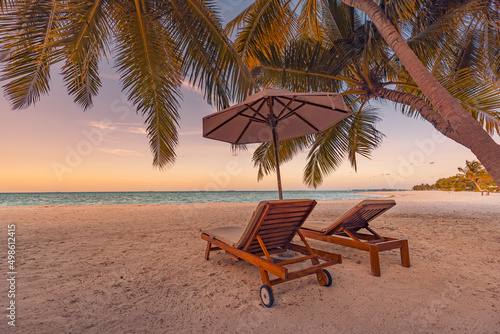 Beautiful beach. Chairs on the sandy beach near the sea. Summer holiday and vacation concept for tourism. Inspirational tropical landscape. Tranquil scenery, relaxing beach, tropical landscape design 