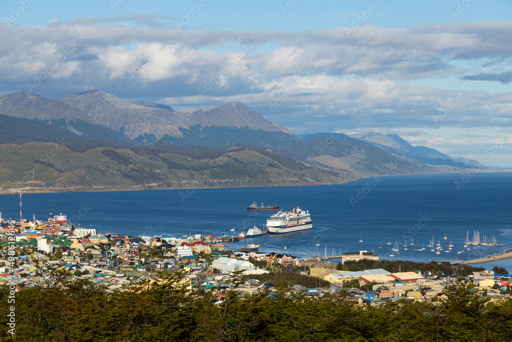 Aerial view of Ushuaia city port with boats and cargo ships. End of the world