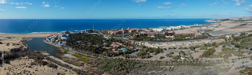 Aerial drone. Popular resort town of Meloneras, with hotels and restaurants, near the Maspalomas dunes in Gran Canaria, Canary Islands, Spain