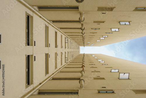 janelas de um prédio vistas por baixo formando uma sequencia  photo