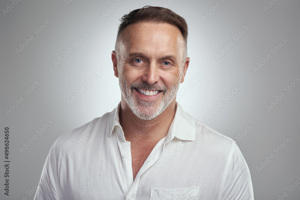 Be confident in who you are. Studio portrait of a mature man standing against a grey background. Be confident in who you are. Studio portrait of a mature man standing against a grey background.