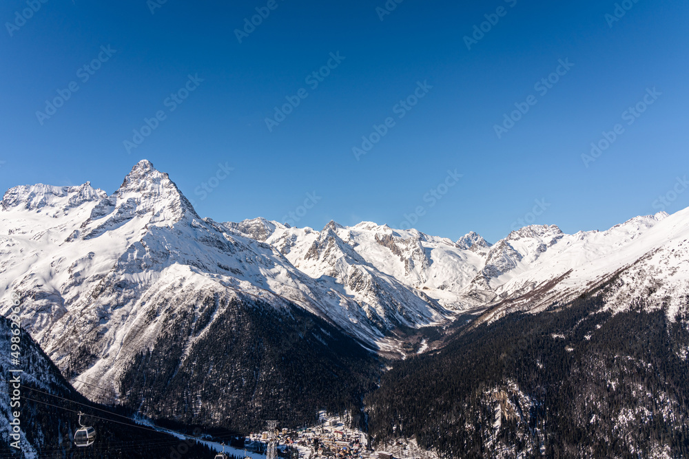 Panorama of winter snowy mountains in Caucasus region, Russia