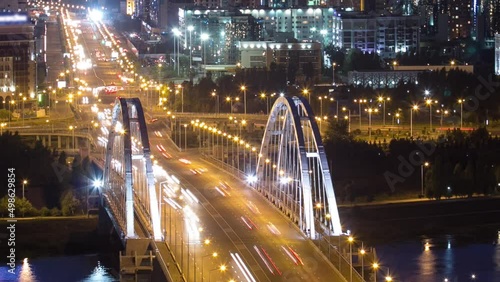 Evening timelapse above the Bridge with the transport and clouds on the background. Central Asia, Kazakhstan, Astana photo