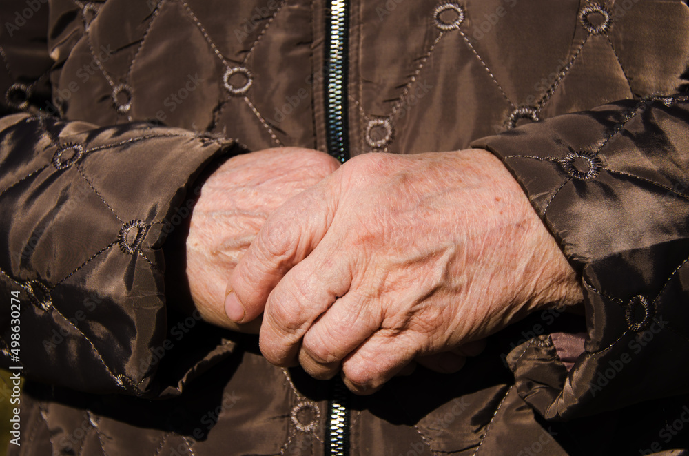 Grandma's wrinkled hands. the concept of pensioners and helping old people. space for text