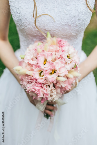 the bride holds a bouquet