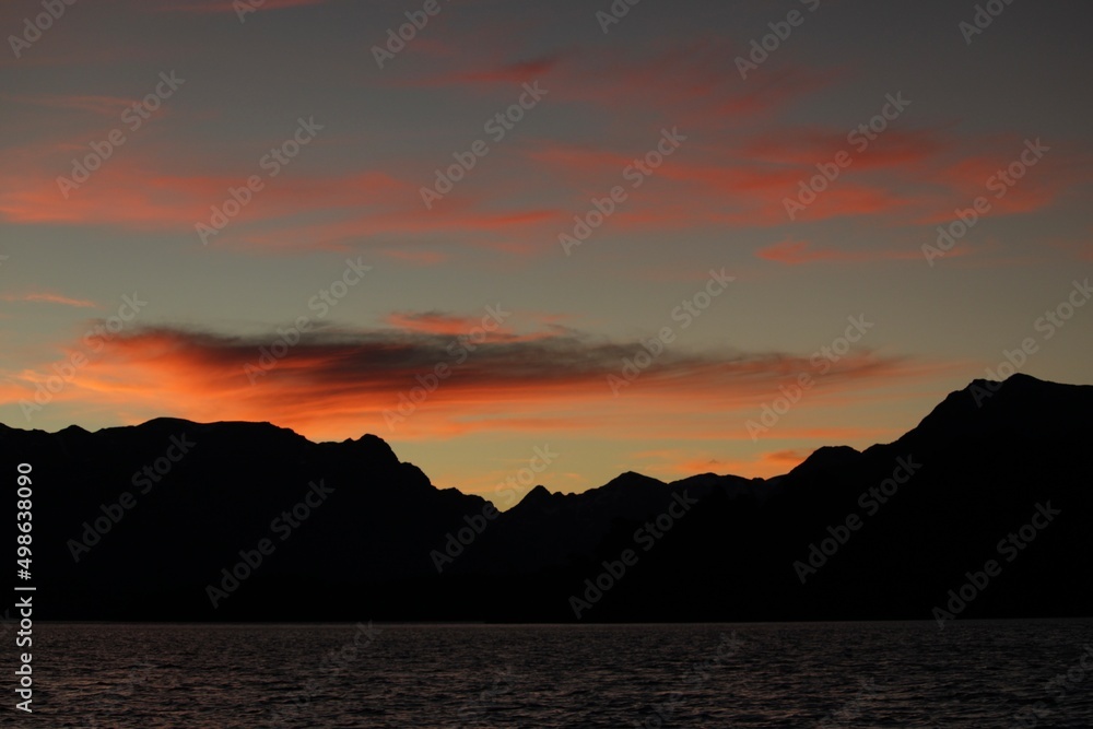 Colorful sunset in Patagonia Argentina. Contrast lake and  mountains with Sky