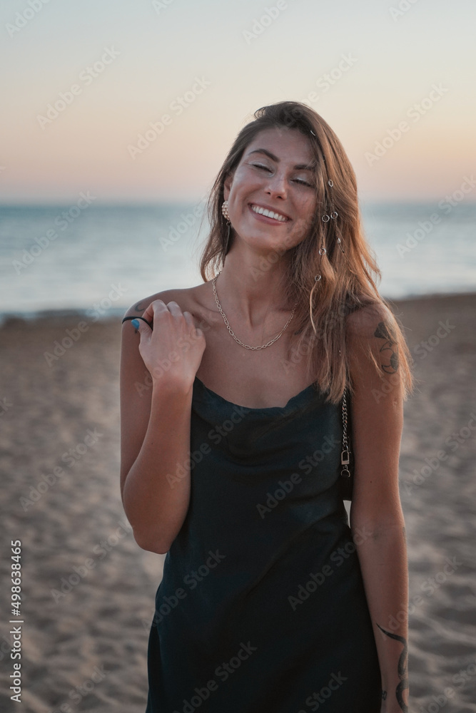 summer girl on the beach in a suit summer girl on the beach in a suit