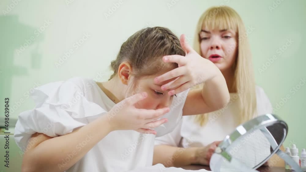 a doctor teaches girl to put on orthokeratological contact lenses a doctor teaches girl to put on orthokeratological contact lenses