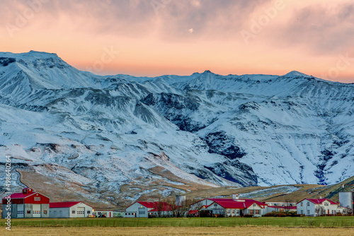 The Icelandic village of Thorvaldseyri with the infamous eyjafjallajokull volcano behind at sunrise photo