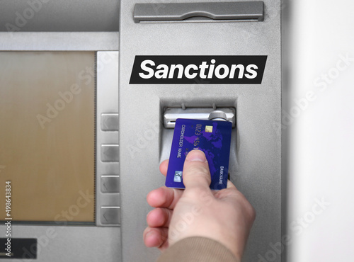Man inserting credit card i...