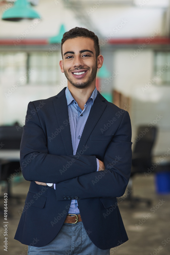 Business is my game. Portrait of a confident young businessman standing in an office. Business is my game. Portrait of a confident young businessman standing in an office.
