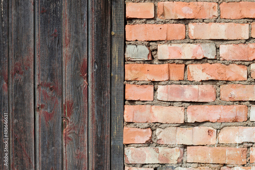 red brick wall and wooden grey door in the countryside