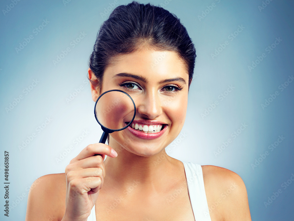 Take a closer look at your lifestyle. Studio portrait of an attractive young woman holding a magnifying glass. Take a closer look at your lifestyle. Studio portrait of an attractive young woman holding a magnifying glass.