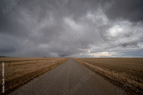 Lonley prairie road leading off into the distance with living skies. © Jeff Whyte