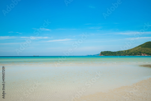 Landscape beach background in Thailand.light blue sky, sea wave and sand beach in pastel style. Concept of summer vacation and holiday tourism.