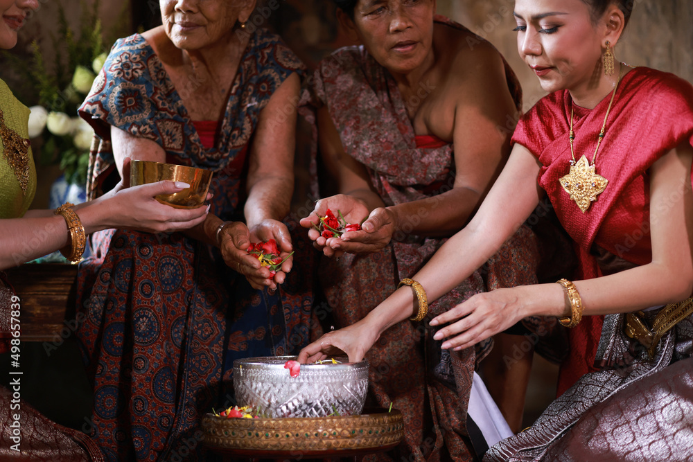 Close up Close-up pour water on the hands of revered elders and ask for blessing, Songkran day, Thai tradition on Songkran day or Thai new year, Watering the Songkran Festival.