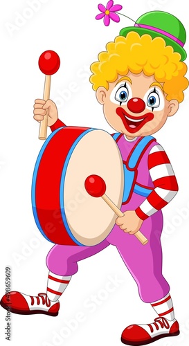 Cartoon happy clown playing the drum