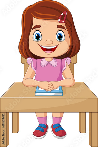 Cartoon little girl studying on the desk