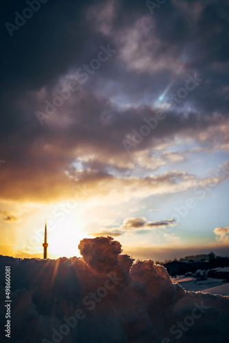 sunset on the city, Winter cityscape,Colorful snowy sunset, Snow and light,Minaret