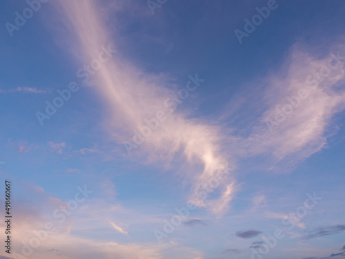 cross and heavenly colorful clouds sky in dawn Easter morning. glory light shines in the high air, sunlight shine in the sky. love and hope in the air. angle wings clouds wide space in atmosphere.