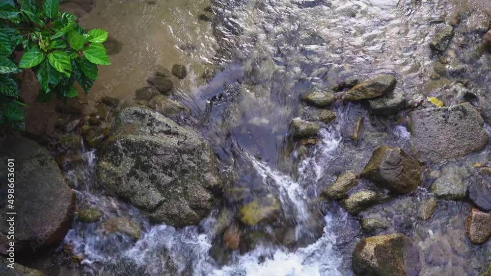 Small decorative waterfall in the natural upstream forest of Thailand Tropical area, bright and comfortable Small decorative waterfall in the natural upstream forest of Thailand Tropical area, bright and comfortable
