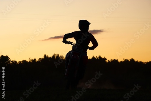 silhouette of motocross rider