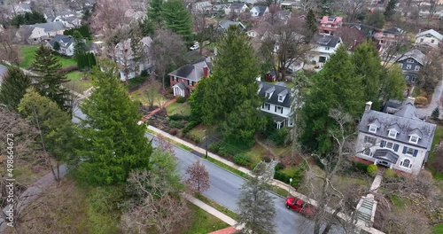 Upscale mansion homes in neighborhood in USA. American town in urban suburb area. Residential district aerial in spring.