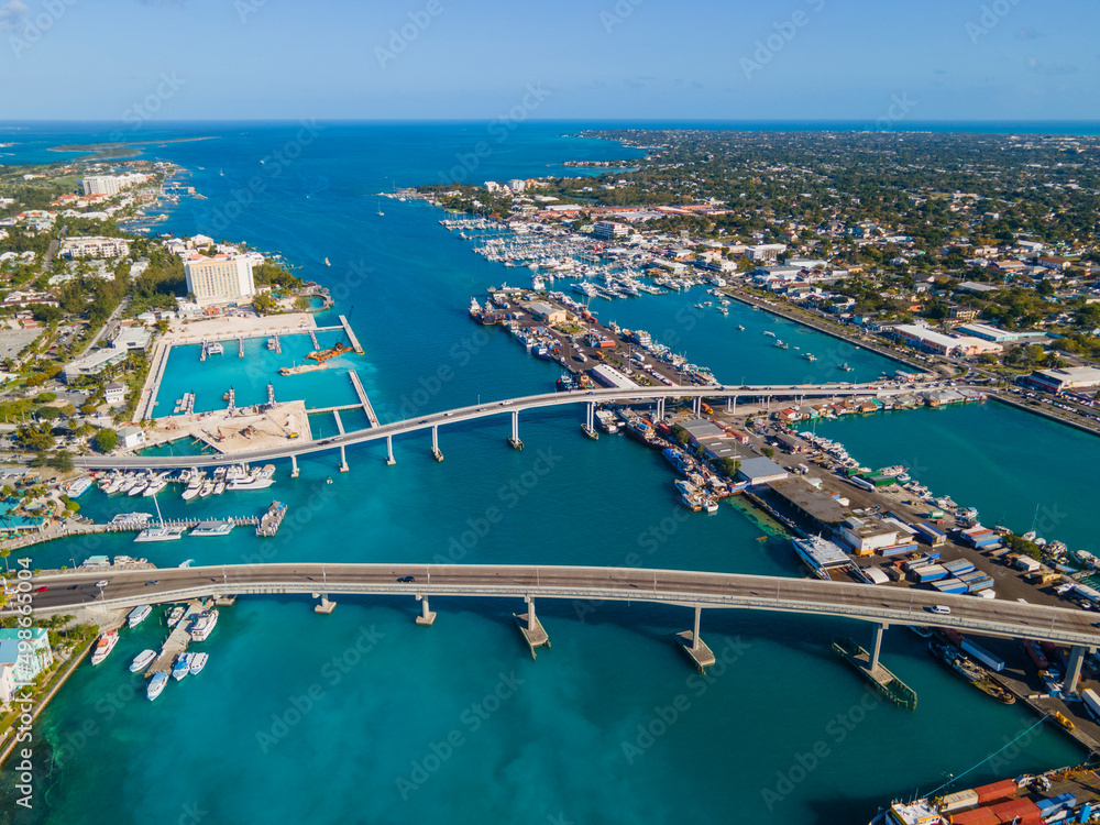 Nassau downtown aerial view including Paradise Island Bridge and Potters Cay in Nassau Harbour, New Providence Island, Bahamas. 