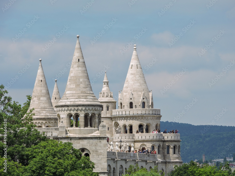 Fototapeta premium Budapest Hungary Old Fairy Tale Castle with Greenery Trees and Spires Close Detail