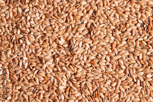 Flax seeds close-up. Macro photo. View from above. Flat lay.