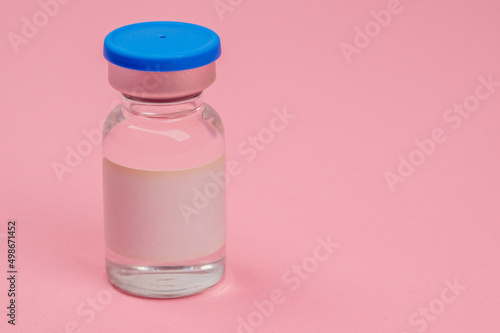 glass vial with liquid for medical injections without text