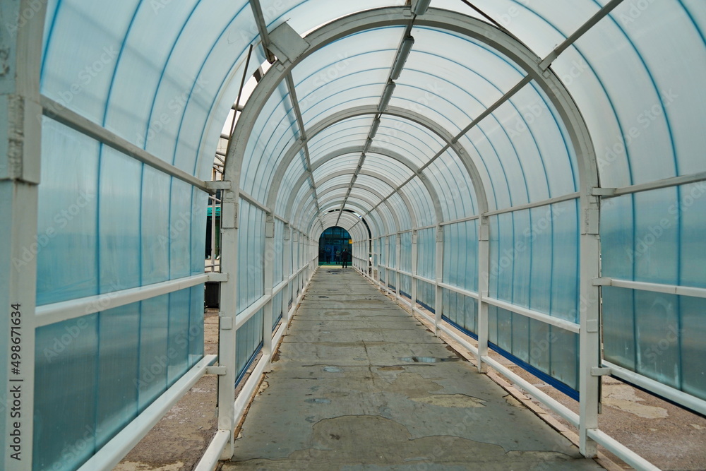 Glass tunnel in front of the international airport building. Glass tunnel in front of the international airport building.