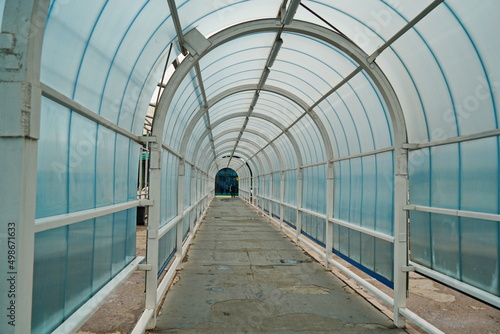 Glass tunnel in front of the international airport building.