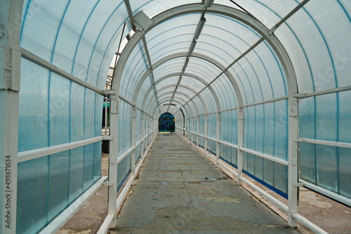 Glass tunnel in front of the international airport building.