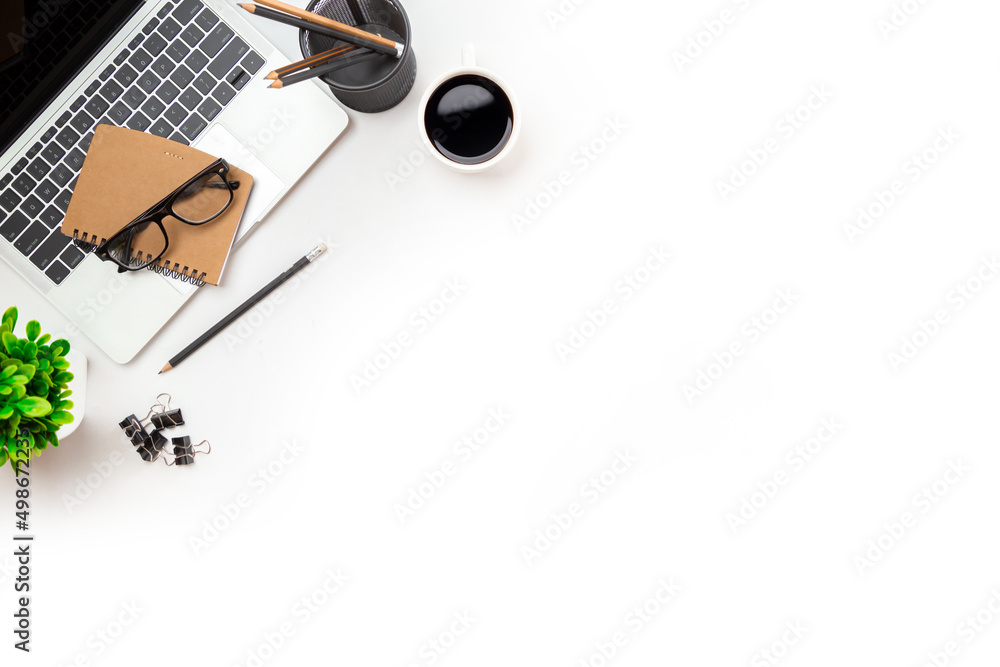 White office desk table with blank notebook, computer keyboard and other office supplies. Top view with copy space, flat lay. White office desk table with blank notebook, computer keyboard and other office supplies. Top view with copy space, flat lay.