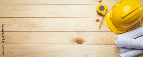 Work safety. Standard Construction site protective equipment on top view wooden background, flat lay, copy space,safety first concepts.