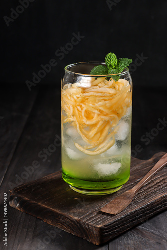 Es Blewah. Indonesian cold fruity drink of cantaloupe strips with syrup, basil seeds on top;