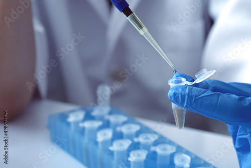 Принти на полотні scientist using auto-pipette with Eppendorf consumables tube in the lab , Doing experiment for product, The researchers analyzed to find the results of the experiment