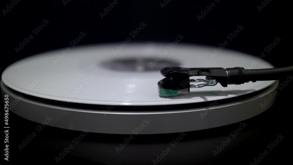 White Vinyl Spinning On Turntable. Close Up View. Locked Off White Vinyl Spinning On Turntable. Close Up View. Locked Off