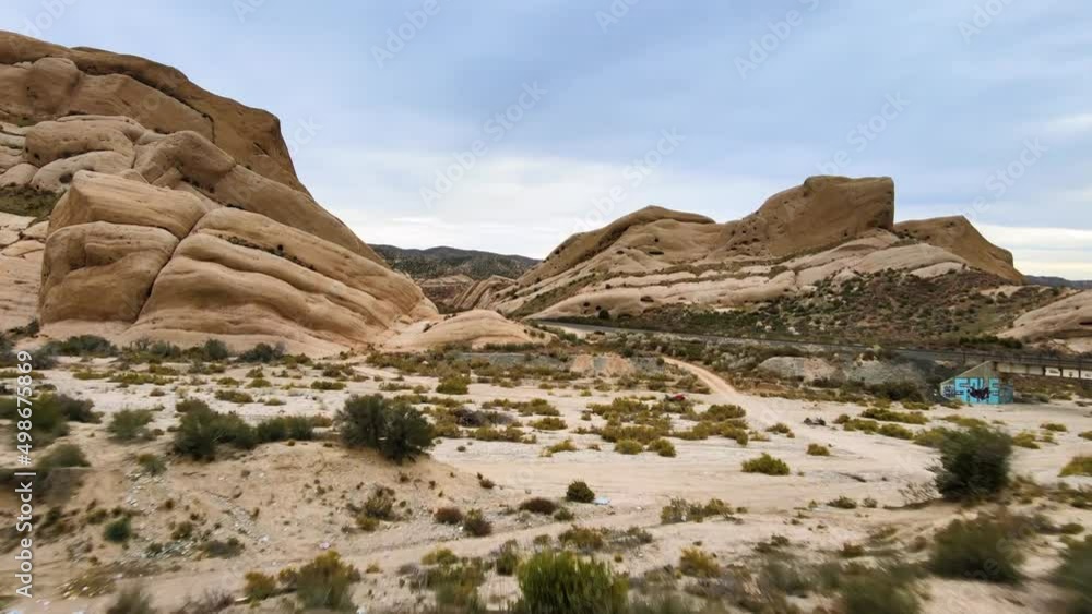 Flying Forward over Shrubs. Sandstone formations in the San Bernardino, CA desert area. Cajon Junction. DJI Mavic Air 2 4k60 footage. Flying Forward over Shrubs. Sandstone formations in the San Bernardino, CA desert area. Cajon Junction. DJI Mavic Air 2 4k60 footage.